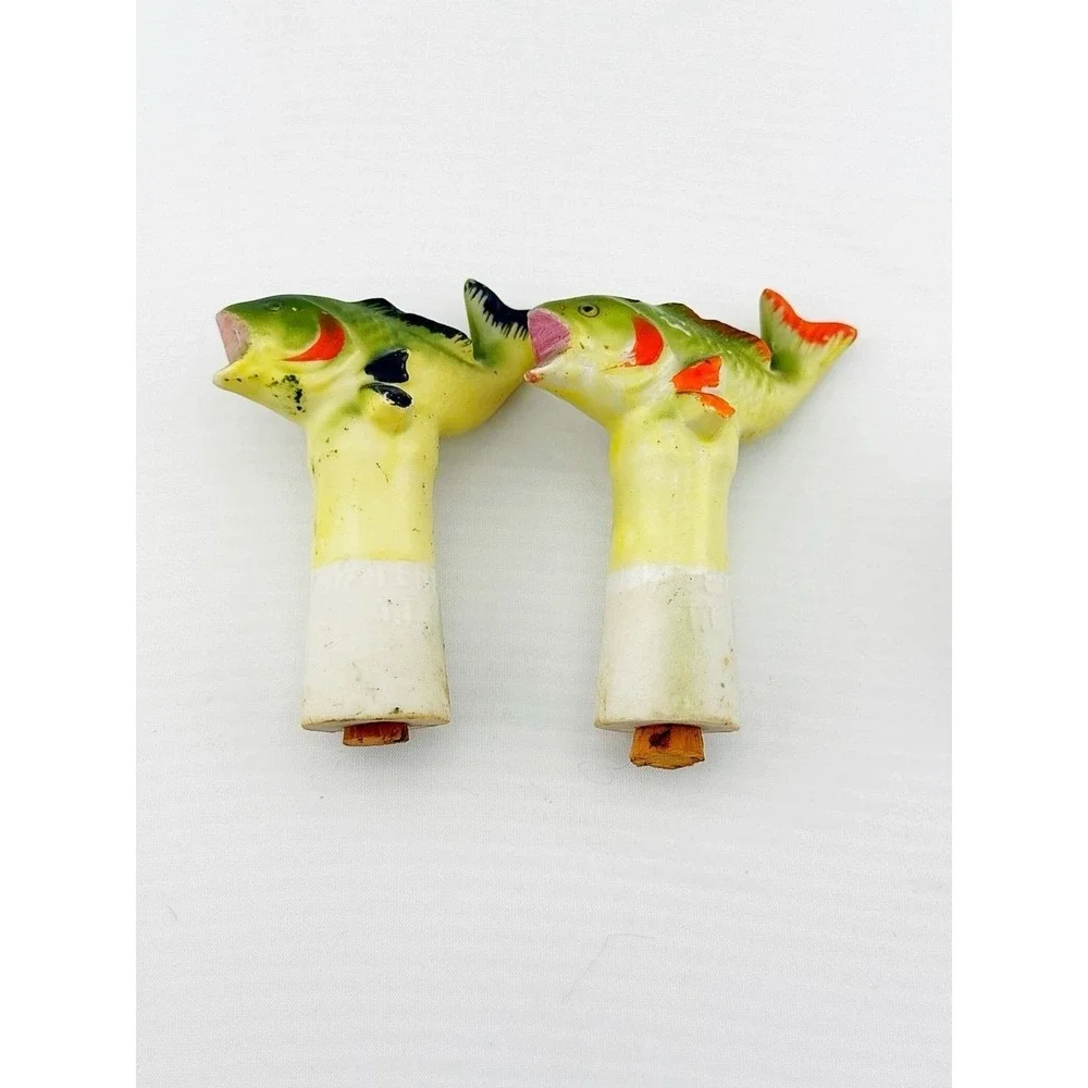 Vintage Japanese porcelain nodder fish salt & pepper shakers with a floral base